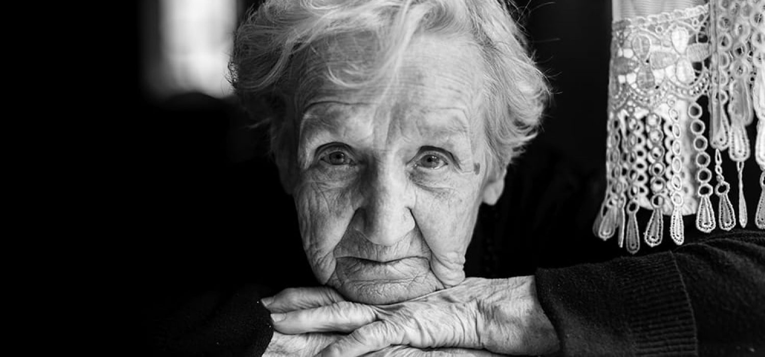 Grandma. Closeup black and white portrait of an elderly woman.